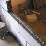 Reinforcement and ligation of aerated concrete partitions