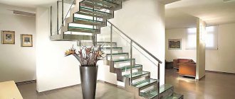 Staircase made of metal and tempered glass